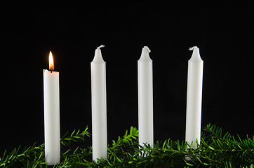 Image showing Four advent candles at black background
