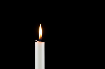 Image showing A white burning candle