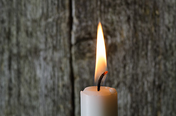 Image showing A single burning candle