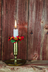 Image showing A burning christmas decorated candle 