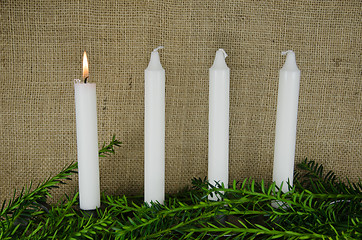 Image showing Four advent candles at a background of burlap