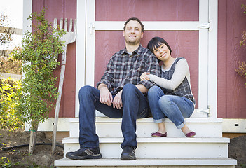 Image showing Mixed Race Couple Relaxing on the Steps