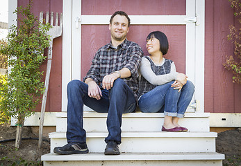 Image showing Mixed Race Couple Relaxing on the Steps