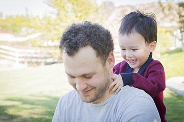 Image showing Caucasian Father Having Fun with His Mixed Race Baby Son