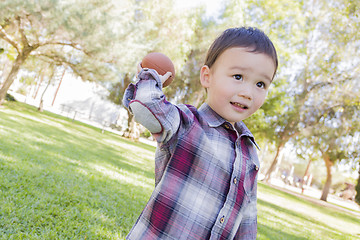 Image showing Mixed Race Boy Playing Football Outside
