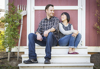 Image showing Mixed Race Couple Relaxing on the Steps