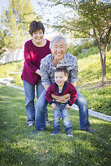 Image showing Chinese Grandparents Having Fun with Their Mixed Race Grandson O