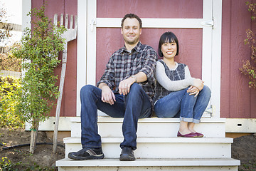 Image showing Mixed Race Couple Relaxing on the Steps