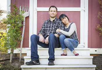 Image showing Mixed Race Couple Relaxing on the Steps