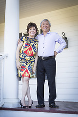 Image showing Attractive Chinese Couple Enjoying Their House