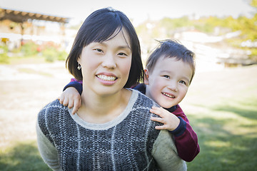 Image showing Chinese Mother Having Fun with Her Mixed Race Baby Son