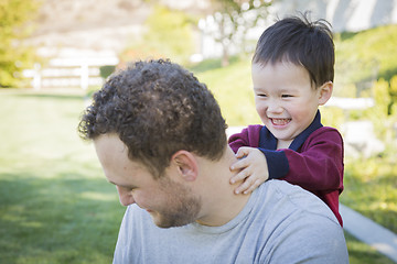 Image showing Caucasian Father Having Fun with His Mixed Race Baby Son