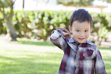 Image showing Mixed Race Boy Playing Football Outside