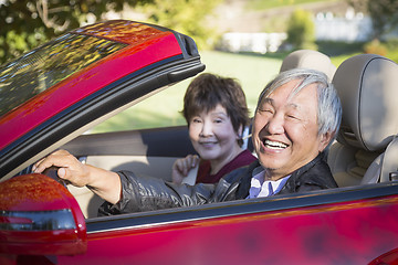 Image showing Happy Chinese Couple Enjoying An Afternoon Drive in Their Conver