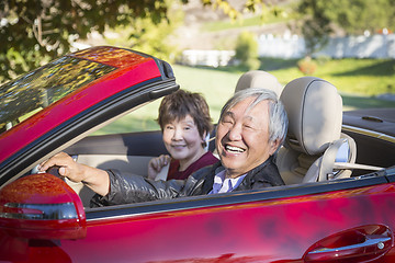 Image showing Happy Chinese Couple Enjoying An Afternoon Drive in Their Conver