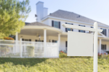 Image showing Blank Real Estate Sign in Front of New House 