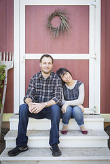 Image showing Mixed Race Couple Relaxing on the Steps