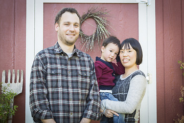 Image showing Mixed Race Family Having Fun Outside