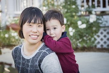 Image showing Chinese Mother Having Fun with Her Mixed Race Baby Son