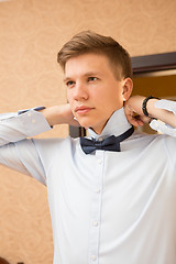 Image showing Elegant young handsome groom. Fashion portrait.