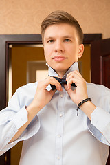 Image showing Elegant young handsome groom. Fashion portrait.