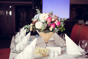 Image showing Beautiful flowers on table
