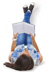 Image showing teenager girl reading book isolated over white background