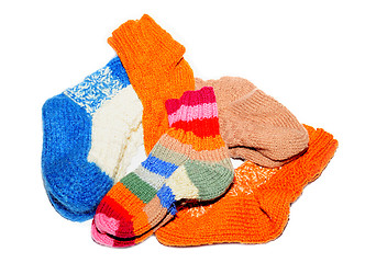 Image showing Warm knitted woolen socks knitting needles isolated on a white background