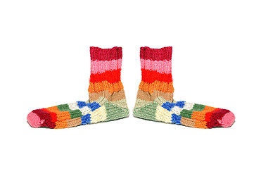 Image showing Warm knitted woolen socks knitting needles isolated on a white background