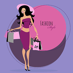 Image showing Fashion girl. Woman with shopping bags.