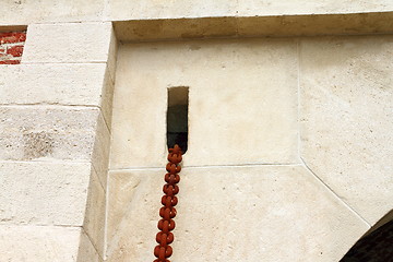 Image showing rusty chain on old castle entrance