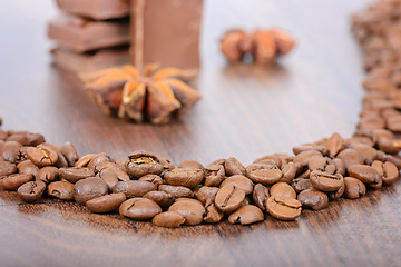 Image showing Coffee beans close up and chocolate