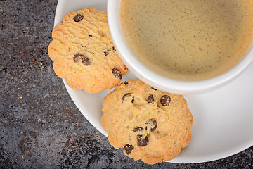 Image showing Cup of coffee americano with cookies on table