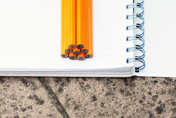 Image showing Note book and pencils