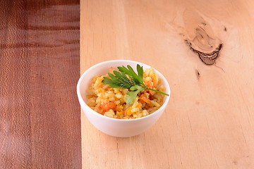 Image showing Chinese cuisine - fried rice with meat on wooden background