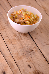 Image showing Chinese cuisine - fried rice with meat on wooden background