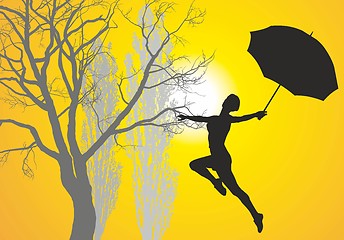 Image showing Woman with umbrella pri at sunrise