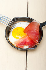 Image showing egg sunny side up with italian speck ham