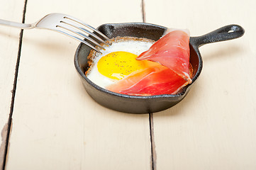 Image showing egg sunny side up with italian speck ham