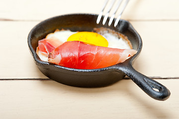 Image showing egg sunny side up with italian speck ham