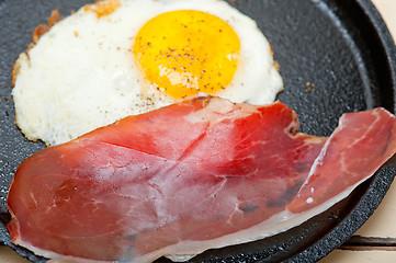 Image showing egg sunny side up with italian speck ham