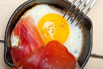 Image showing egg sunny side up with italian speck ham