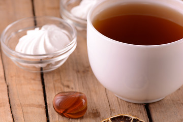 Image showing A cup of tea on wooden background