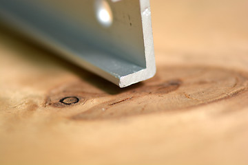 Image showing close up metal details on wooden background