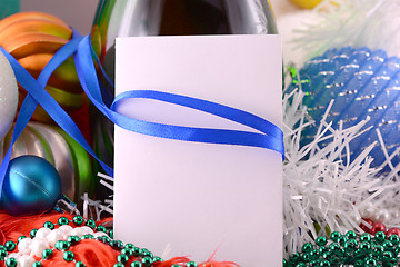 Image showing Christmas background with wine bottle pearls and empty paper note