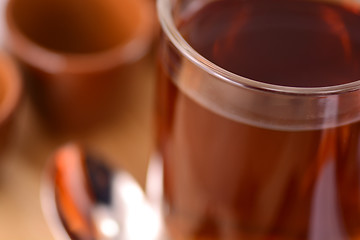 Image showing A cup of tea on wooden background