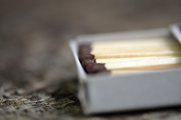 Image showing wood match on paper box close up