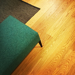 Image showing Green stool on wooden floor