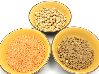 Image showing Three bowls of ceramic with garbanzos lentils and red lentils