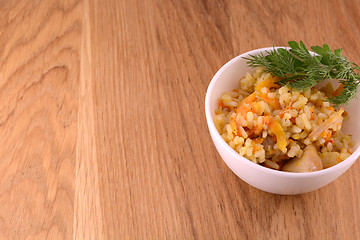 Image showing Chinese cuisine - fried rice with meat on wooden background